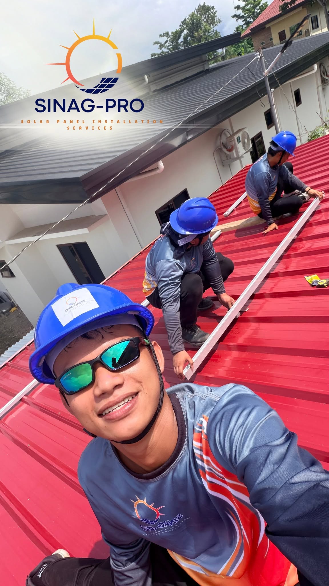 Installation crew working on a metal roof