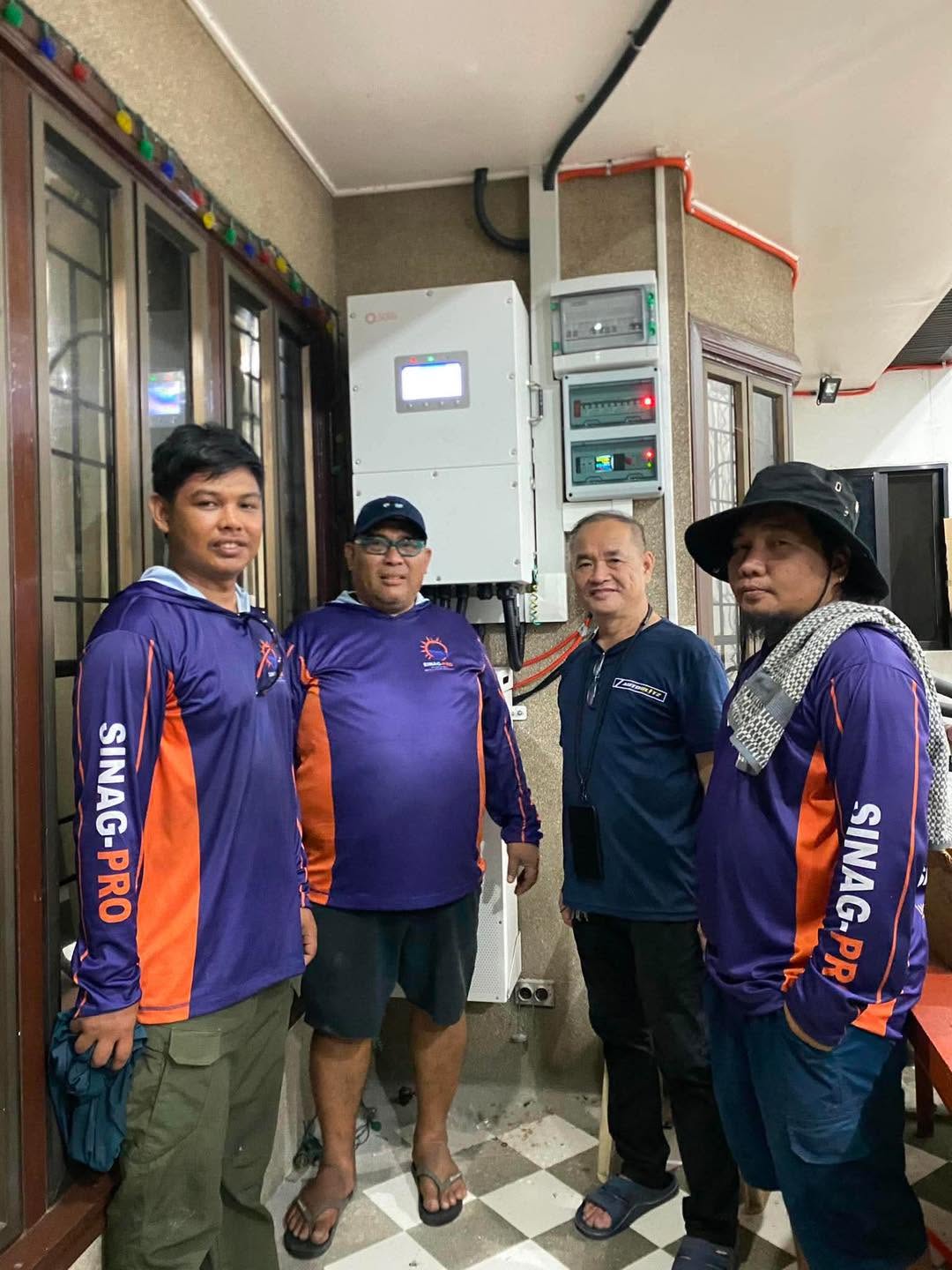 SINAG-PRO team with a customer and installed system